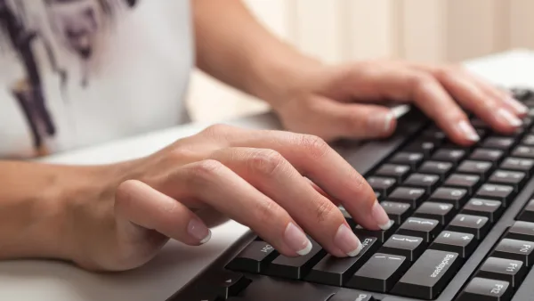 Women typing on a keyboard