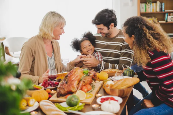 Family creating memories in a dining table with Indiana child care resources, family hack, Paths to Quality Resources Available