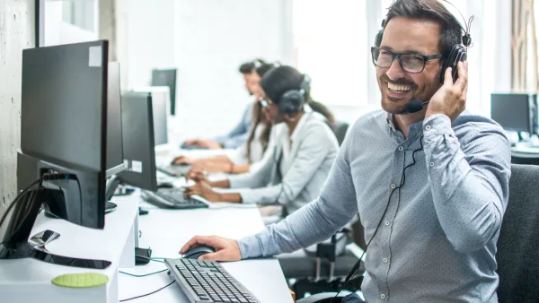 A man on the phone via headset