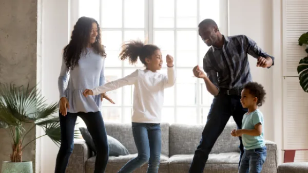 A family having a dance party in living room