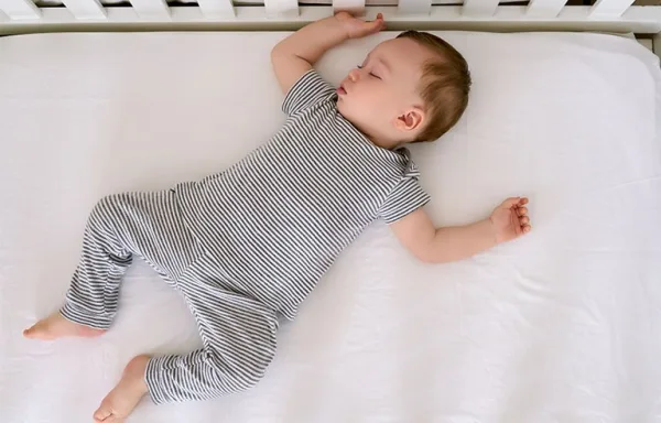 Baby asleep in crib