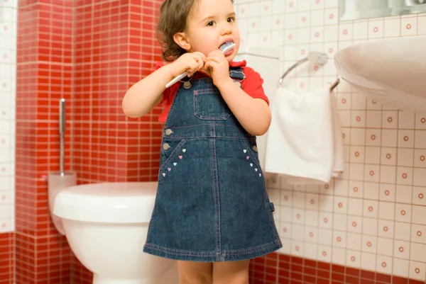 A child brushing teeth