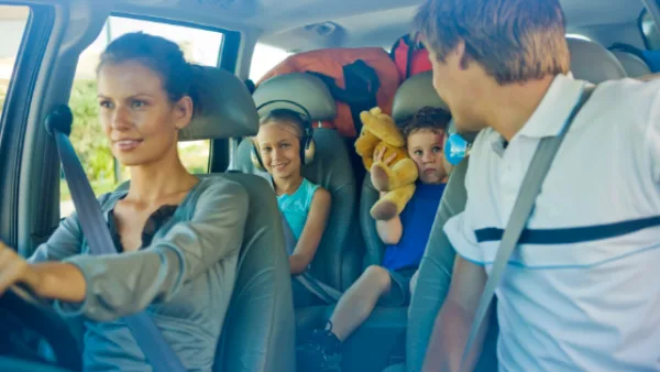 A family on a road trip in a car