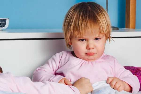 A baby making a frown